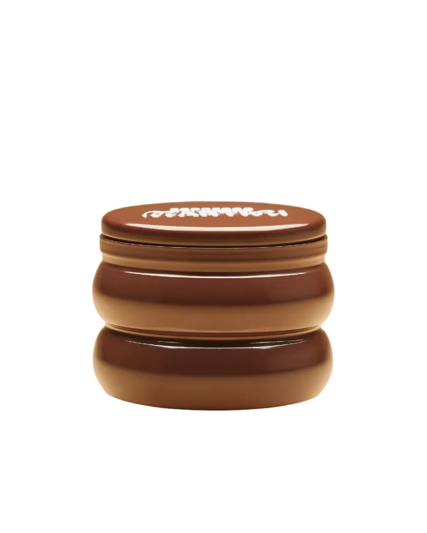candle in a brown tin