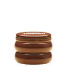 candle in a brown tin