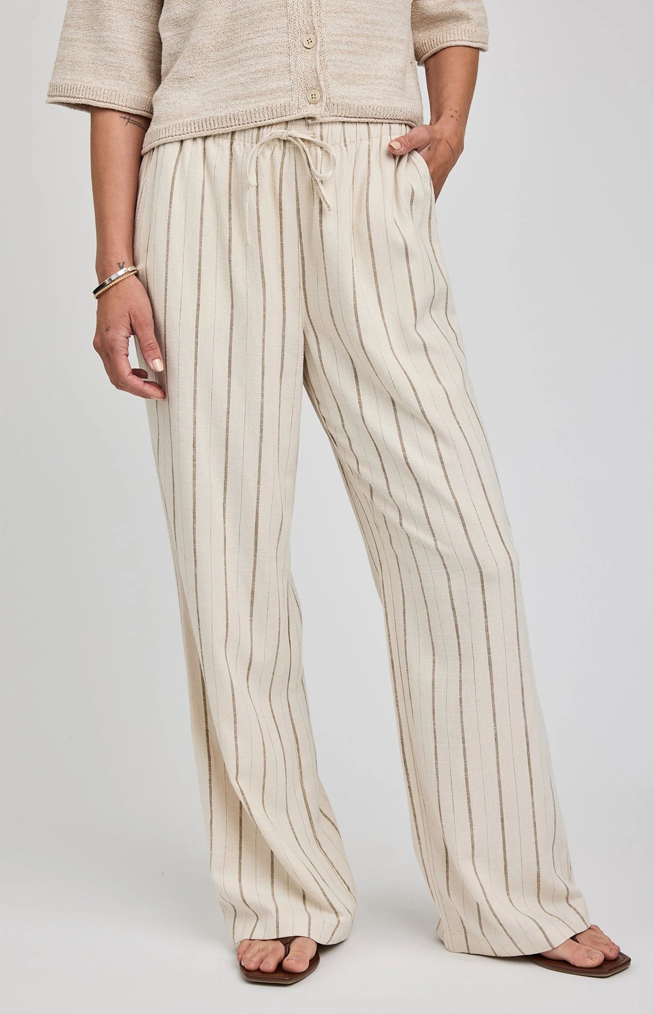 wide leg linen pant in beige with a stripe down them