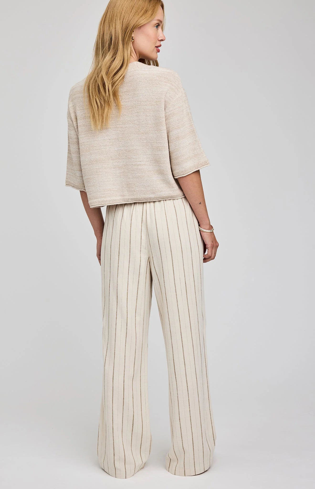 wide leg linen pant in beige with a stripe down them