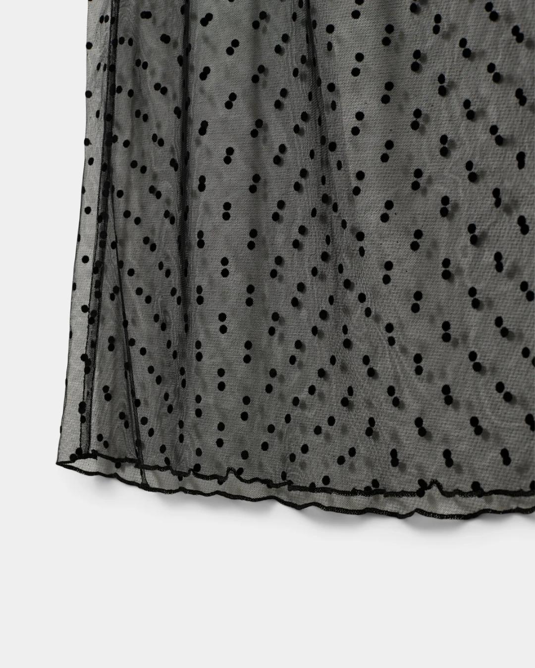 sheer black skirt with polka dots