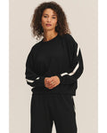 black crewneck sweatshirt with a white stripe across the back and arms