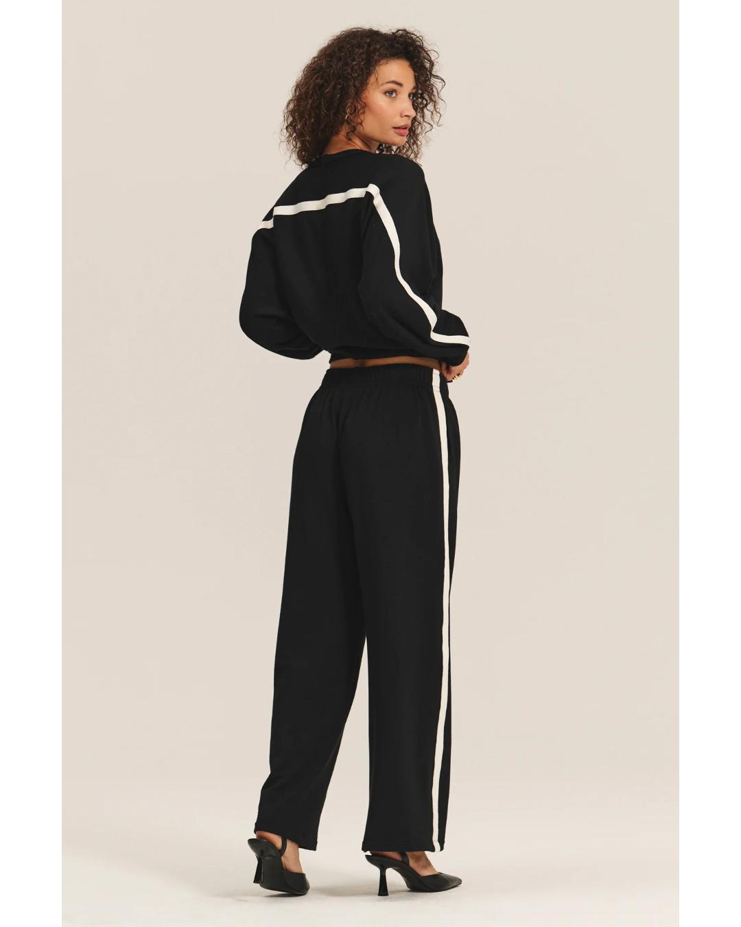 black crewneck sweatshirt with a white stripe across the back and arms