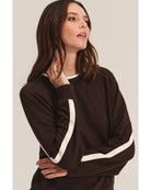 brown sweatshirt with a cream stripe through the back and arms