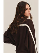  brown sweatshirt with a cream stripe through the back and arms
