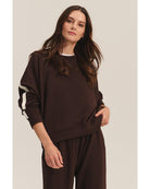 brown sweatshirt with a cream stripe through the back and arms