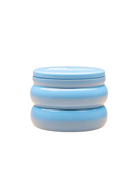 candle in blue tin