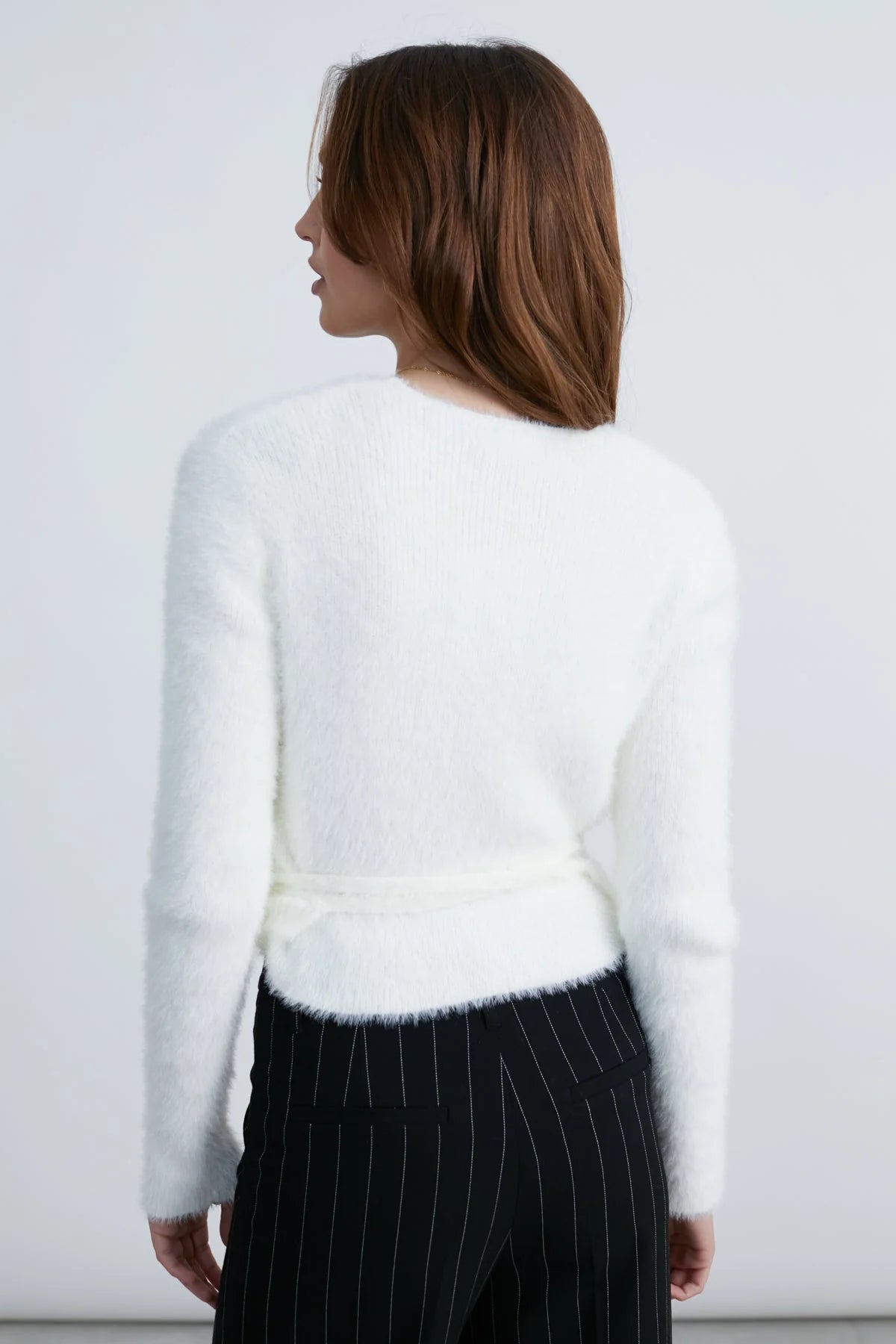 fuzzy white cardigan that wraps at the waist