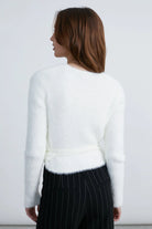 fuzzy white cardigan that wraps at the waist