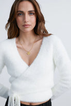fuzzy white cardigan that wraps at the waist