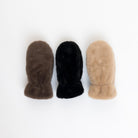 three fuzzy mittens in brown, black and camel