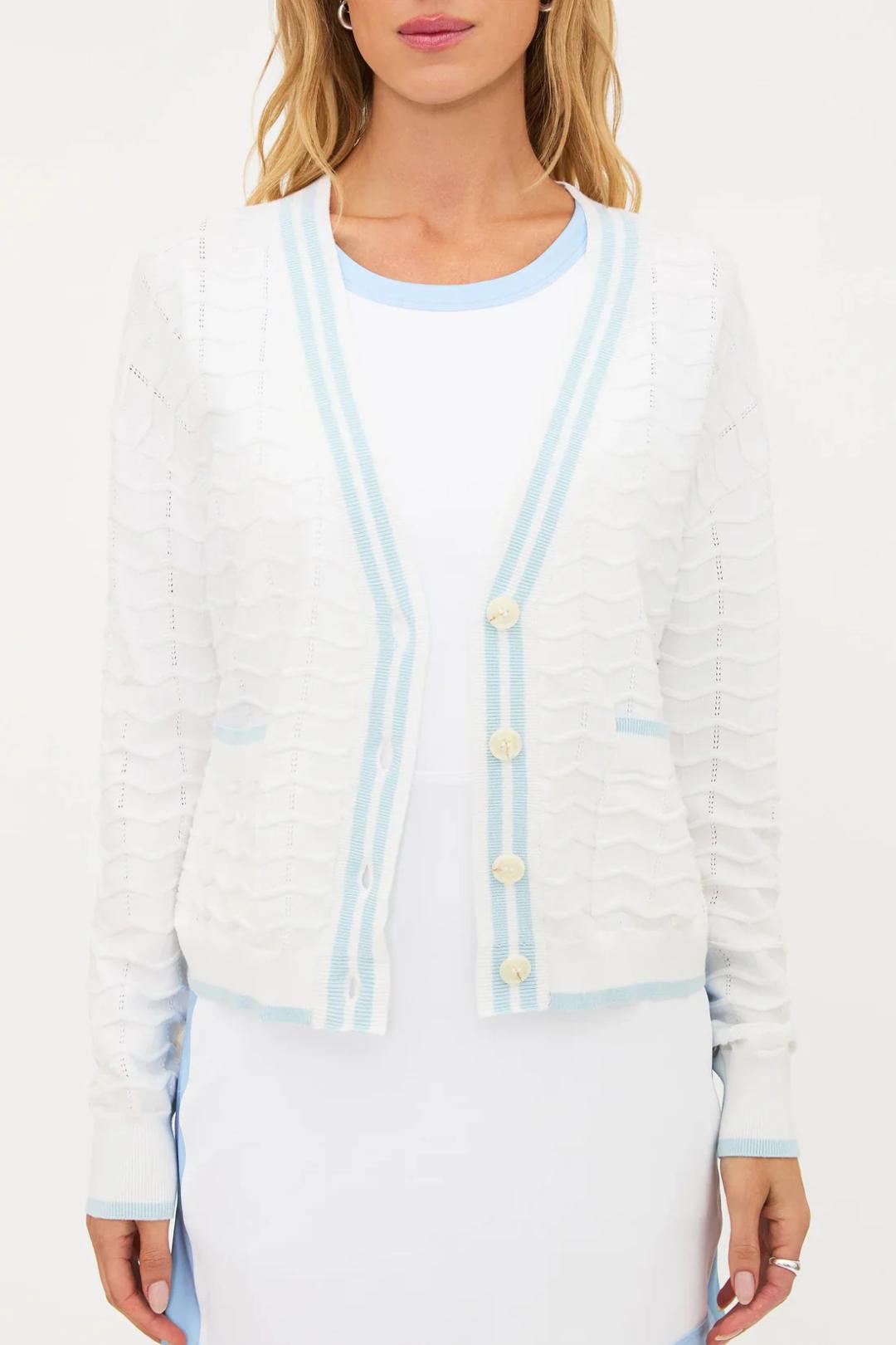 white v-neck cardigan with blue stripes down middle and pockets