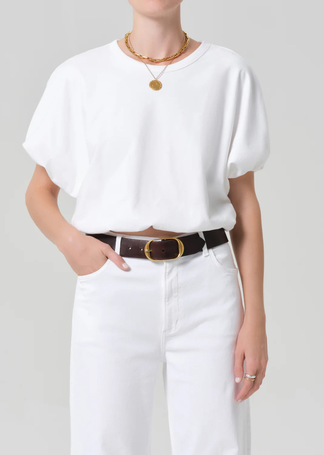 white cropped short sleeve top with a bubble waist and sleeve
