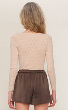 brown satin short with a cream trim on the side