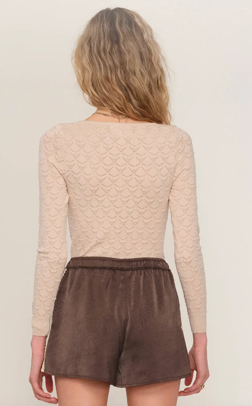 brown satin short with a cream trim on the side