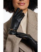 faux leather gloves in black with a gold buckle at wrist