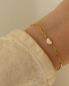 gold link bracelet with a heart