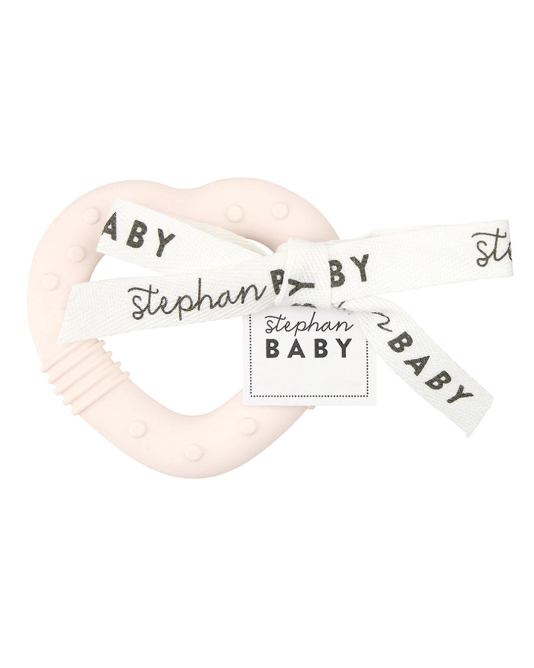 light pink baby teether in the shape of a heart