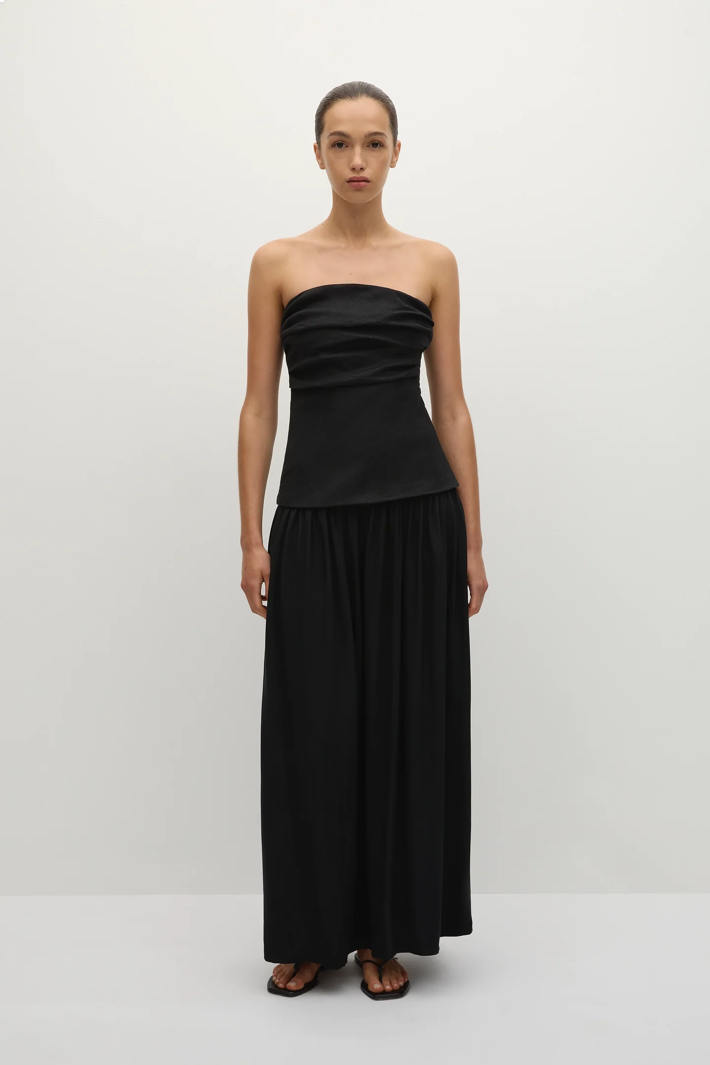 black maxi dress in black that is strapless