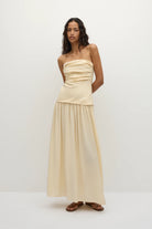 strapless maxi dress in a yellowish cream colour