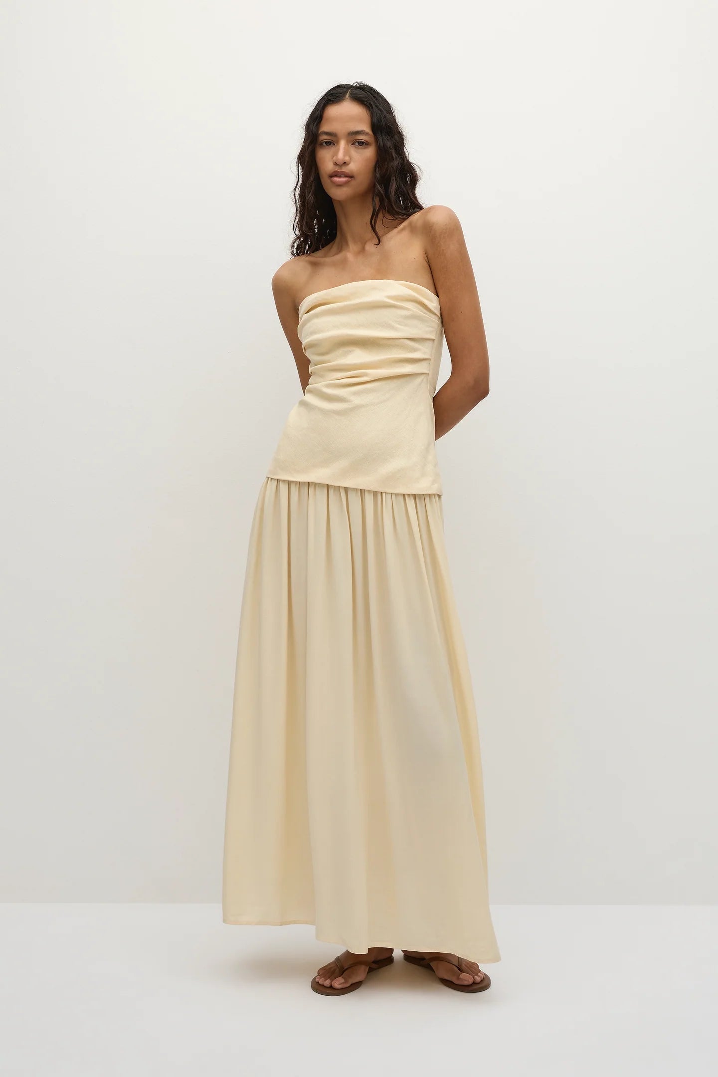 strapless maxi dress in a yellowish cream colour