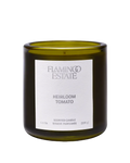 candle in green glass container