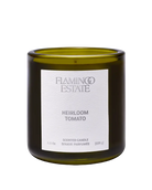 candle in green glass container