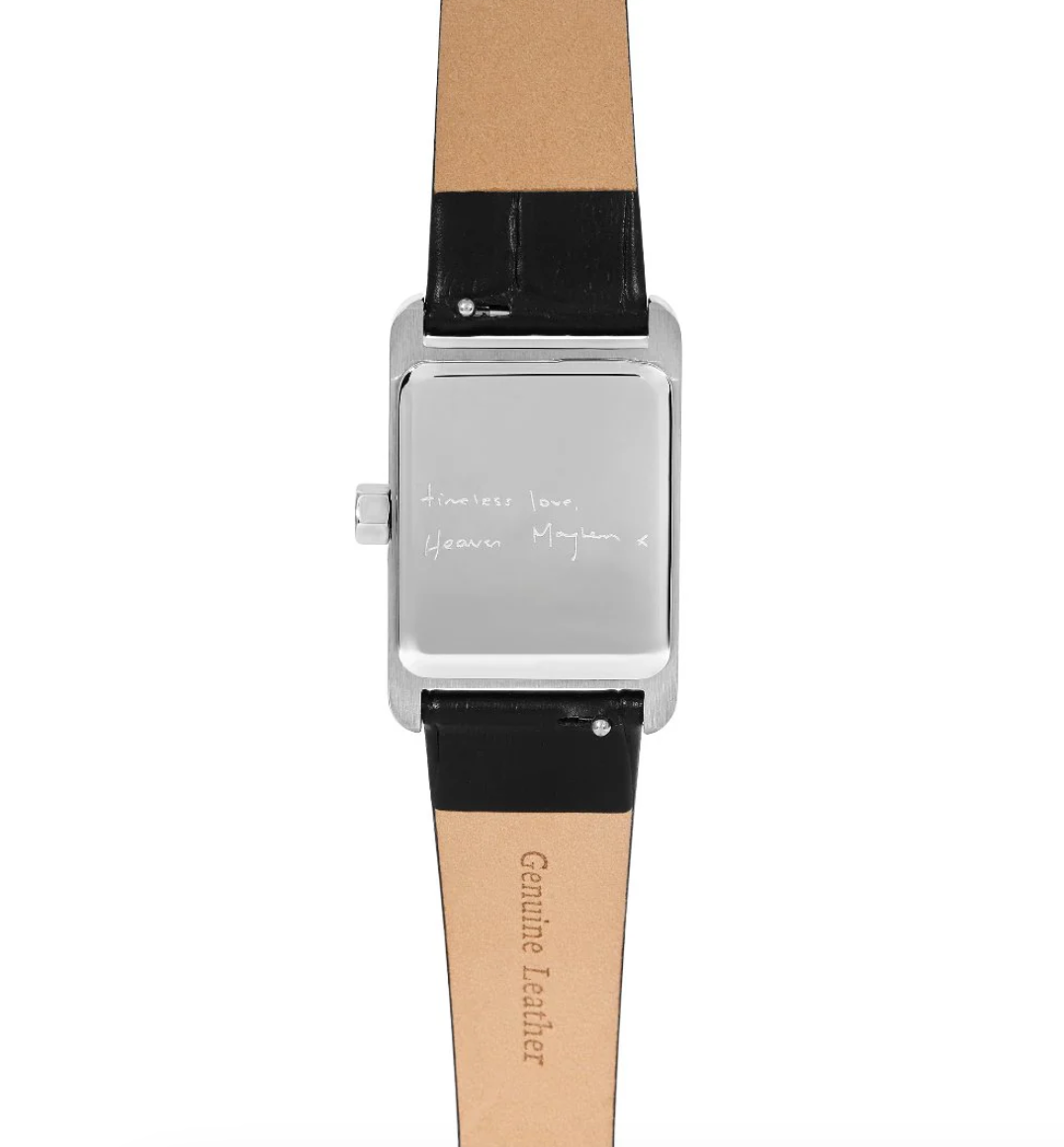 wrist watch with a black leather strap and silver and white face