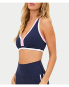 navy racerback sports bra with pink and white outline