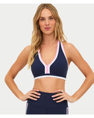 navy racerback sports bra with pink and white outline