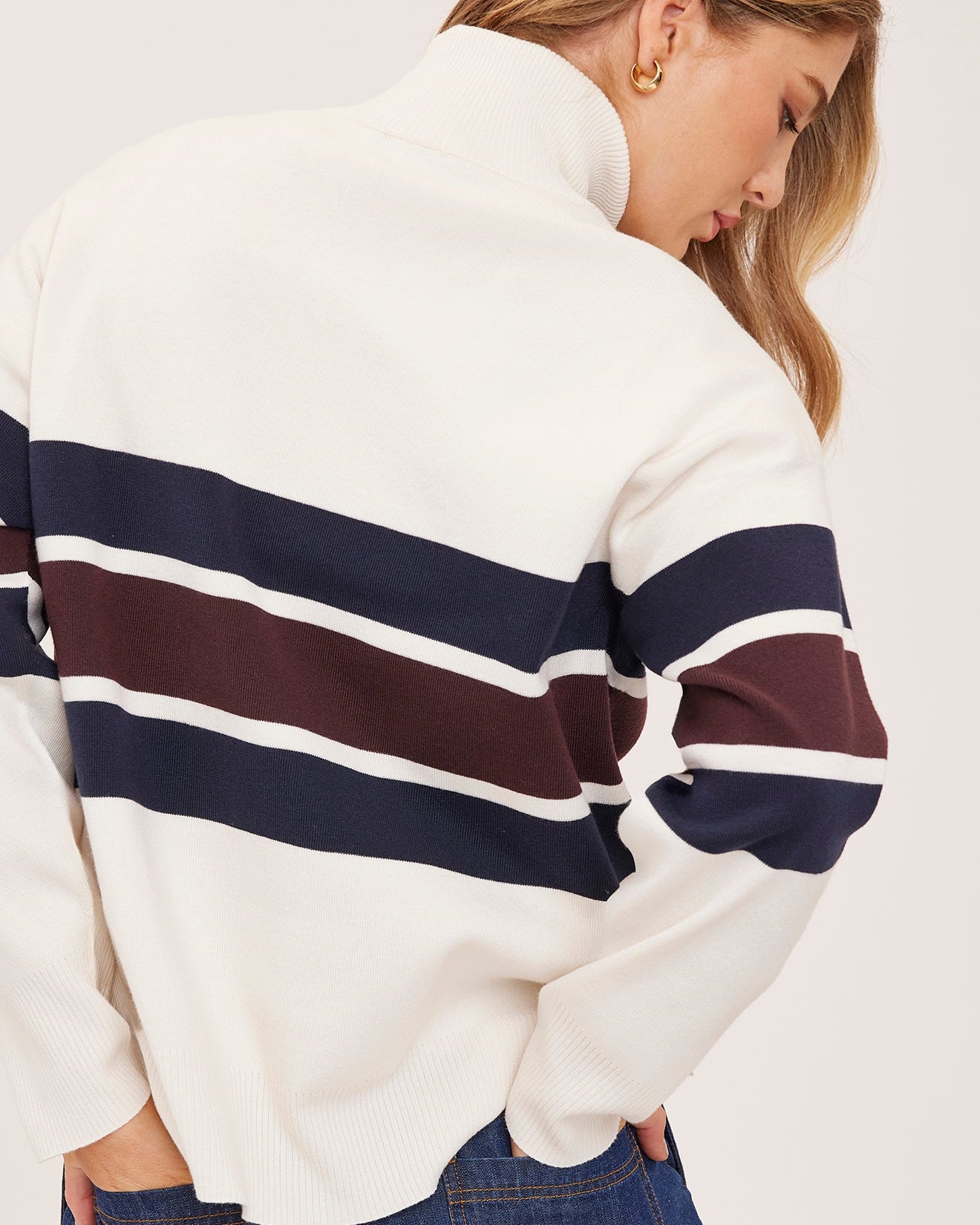 cream half zip sweater with navy and burgundy stripe