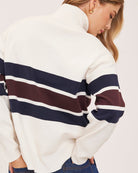 cream half zip sweater with navy and burgundy stripe