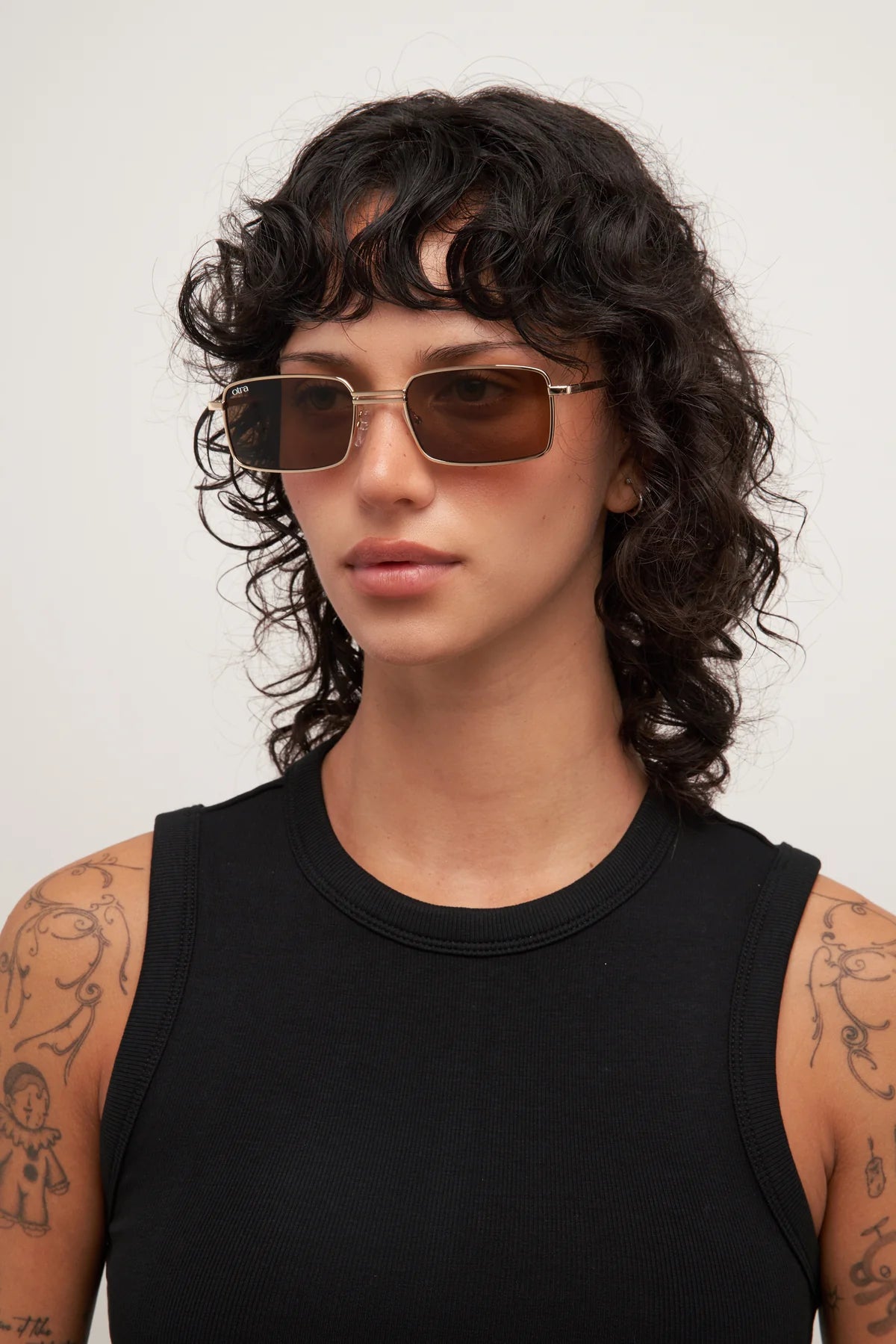 rectangular sunglasses with a gold frame and brown lenses 