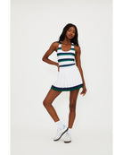 white pleated tennis skirt with navy and green stripe around the bottom