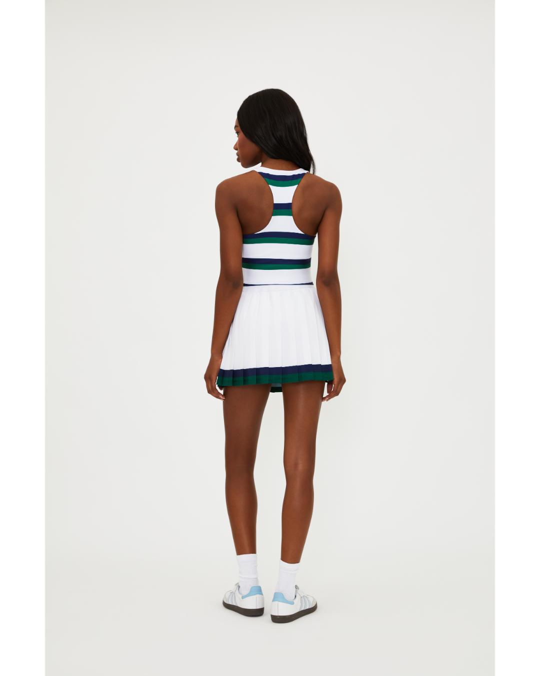 white pleated tennis skirt with navy and green stripe around the bottom