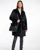 large black and fur purse