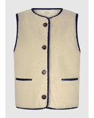 teddy vest in cream with black stitching 