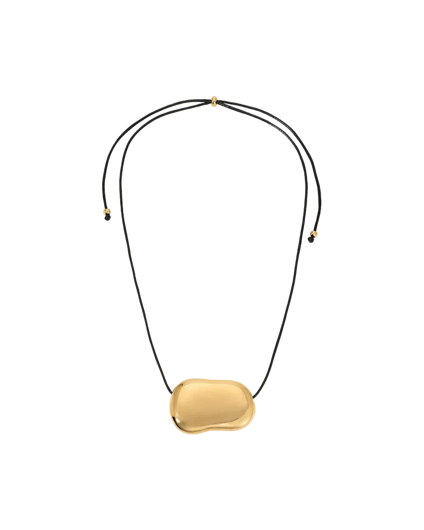 black string necklace with statement gold pendent 