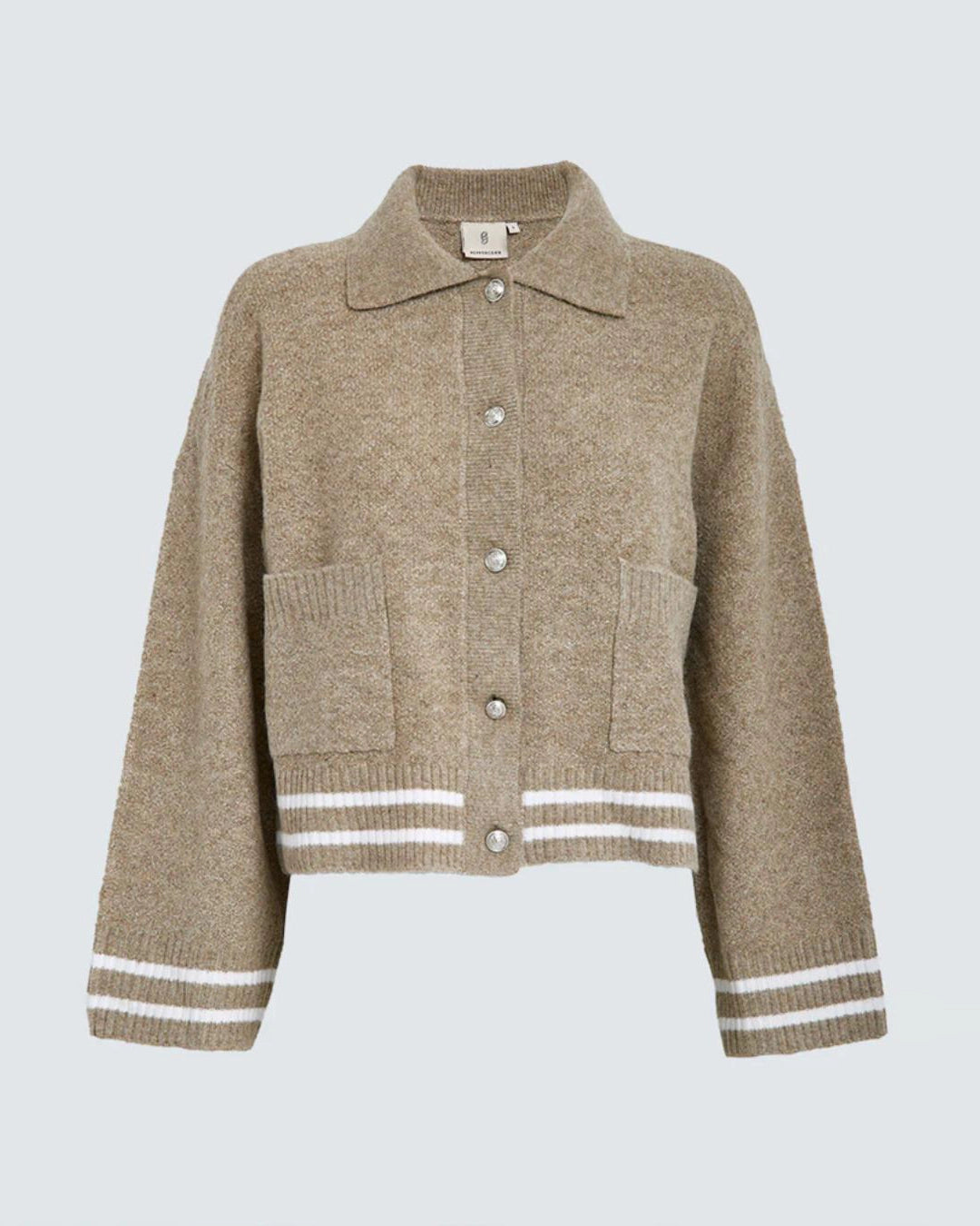 a beige knitted button down jacket with white trim
