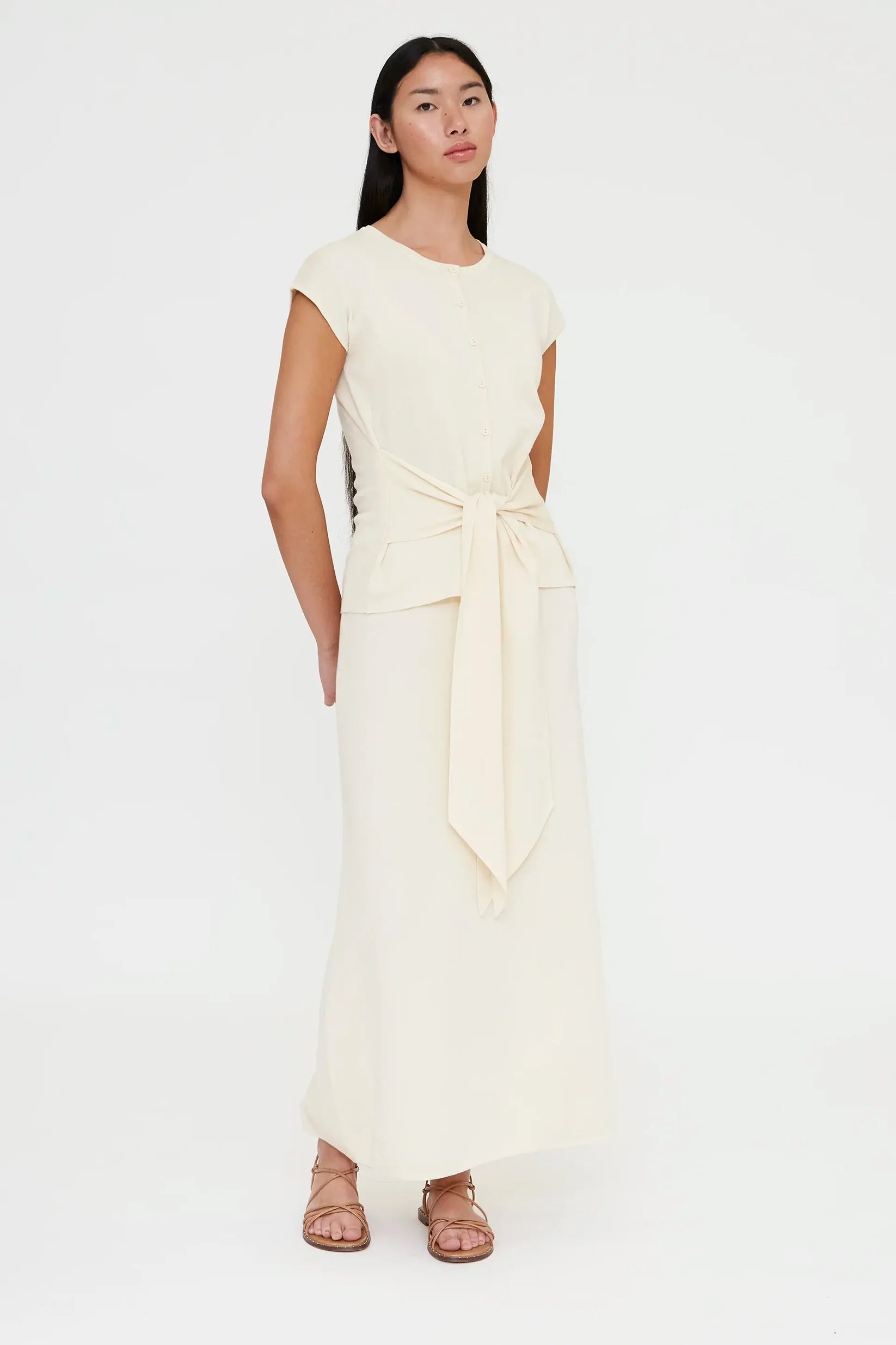 off white shirt sleeve cardigan with a large tie in the front