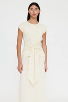 off white shirt sleeve cardigan with a large tie in the front
