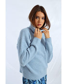 light blue turtleneck sweater