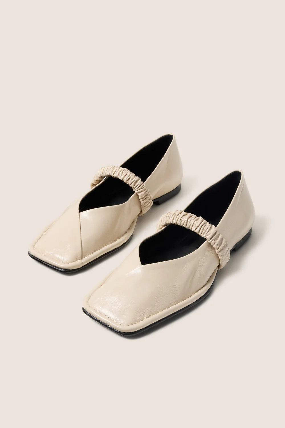 cream leather ballet flat with a square toe and a ruched strap