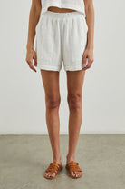 a white gauzy short with pockets