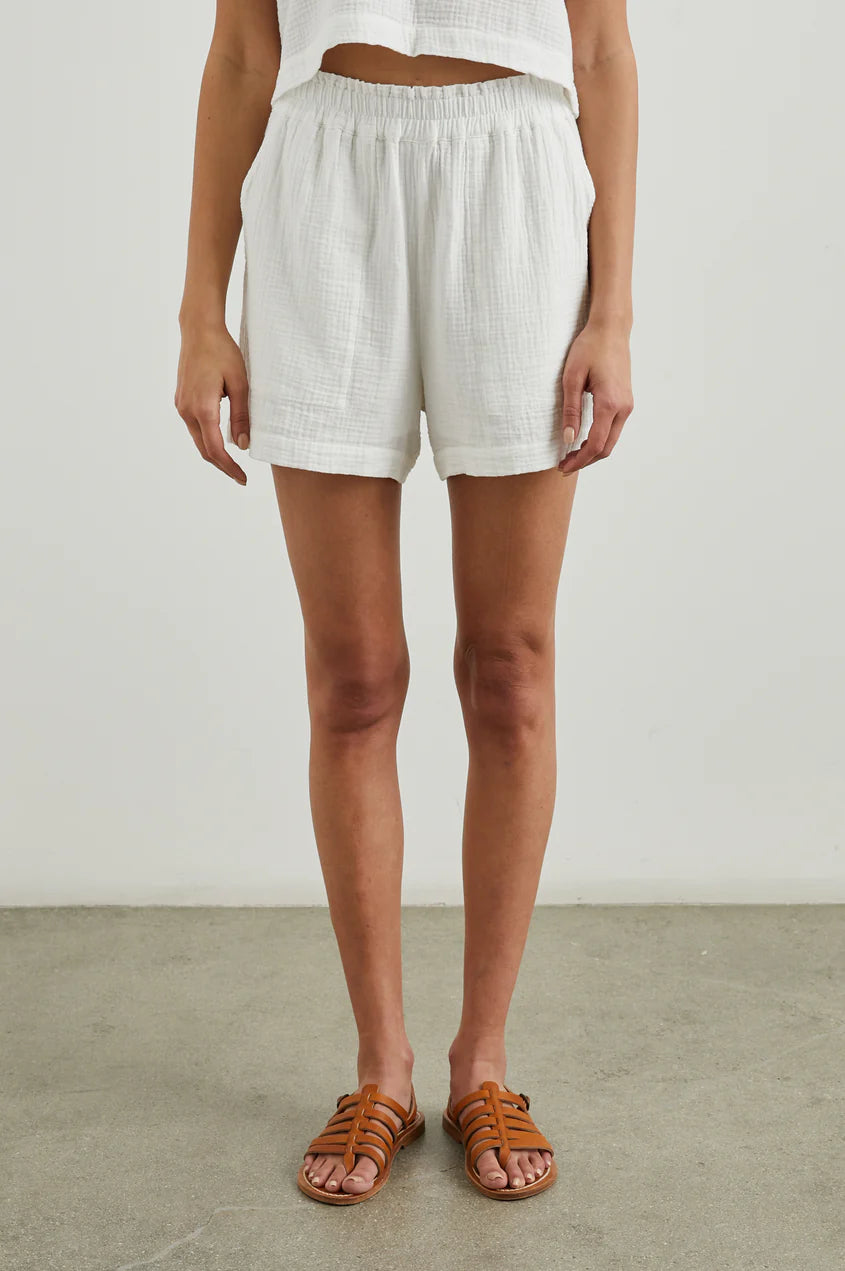 a white gauzy short with pockets