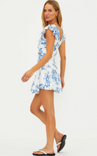 white mini dress with blue floral prints
