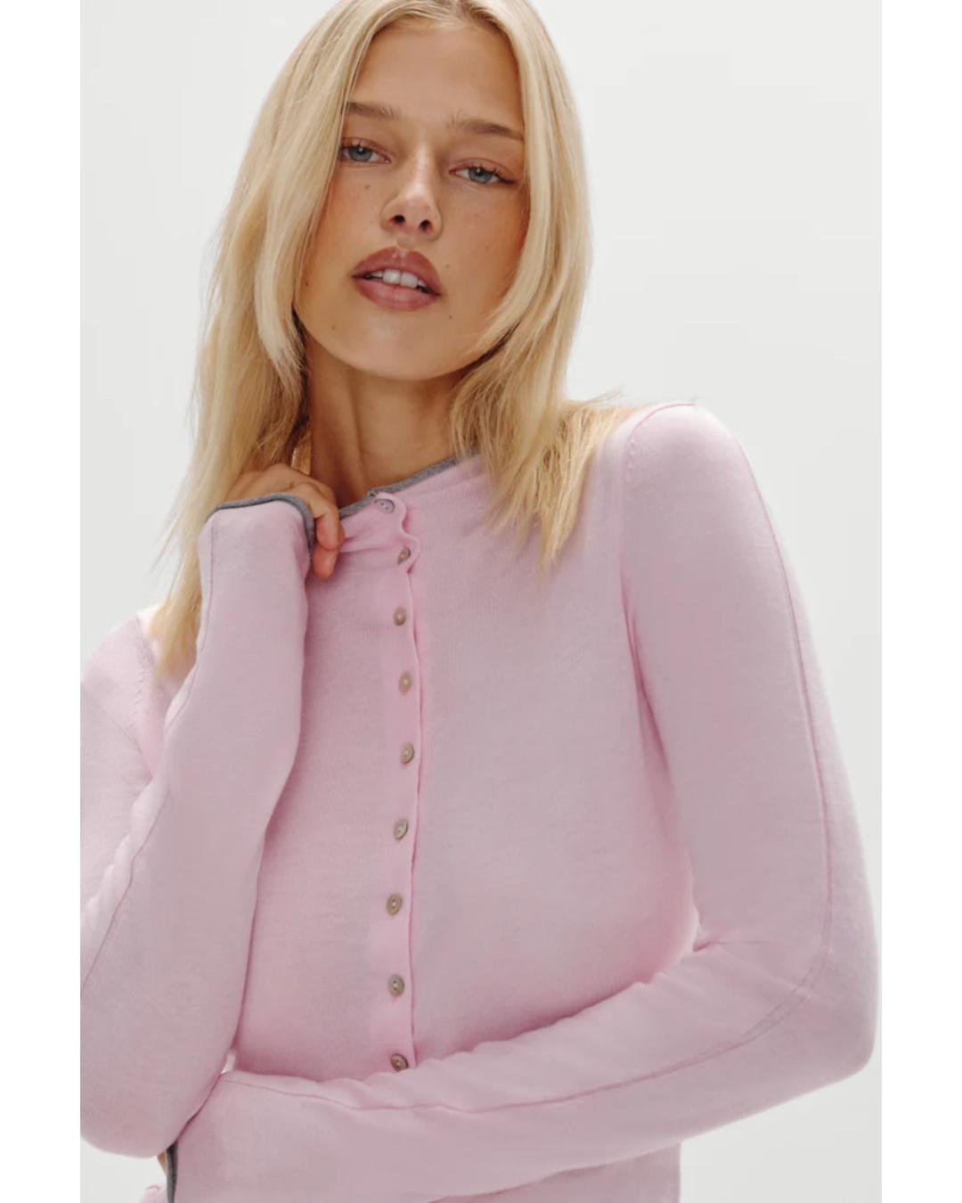 pink button up cardigan with grey on the top and bottom