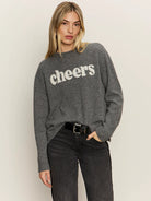 grey sweater with the text cheers