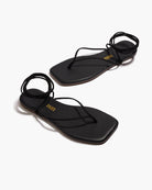 black sandal that wraps around the ankle