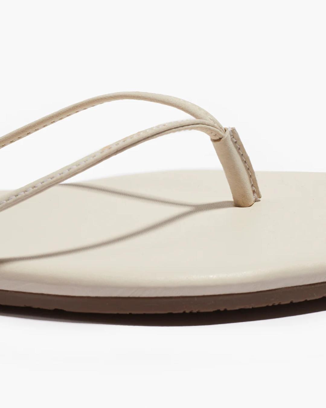 close up of a cream sandal